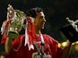 Liverpool's Robbie Fowler holds aloft The Worthington Cup and Man of the Match trophies after beating Birmingham City at The Millenium Stadium in Cardiff Sunday 25 February 2001