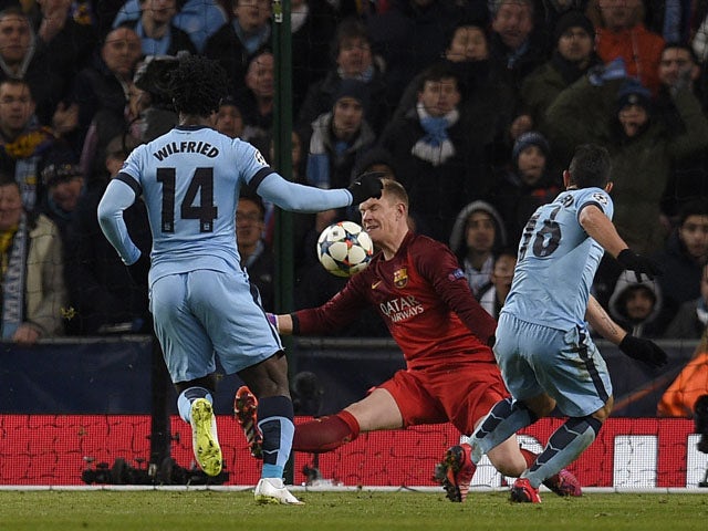 Manchester City's Argentinian striker Sergio Aguero scores his team's first goal during the UEFA Champions League round of 16 first leg football match between Manchester City and Barcelona at the Etihad Stadium in Manchester, northwest England, on Februar
