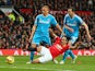 Radamel Falcao of Manchester United is brought down in the area by Wes Brown and John O'Shea of Sunderland to win a penalty during the Barclays Premier League match between Manchester United and Sunderland at Old Trafford on February 28, 2015