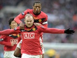 Manchester United's Wayne Rooney celebrates his goal against Aston Villa wth team-mate Patrice Evra during the 2010 Carling Cup final at Wembley in London, on February 28, 2010