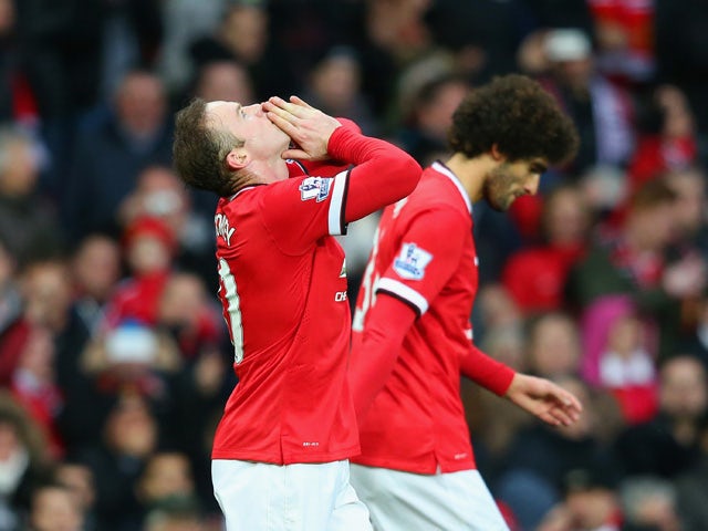 Wayne Rooney of Manchester United celebrates scoring their second goal during the Barclays Premier League match between Manchester United and Sunderland at Old Trafford on February 28, 2015