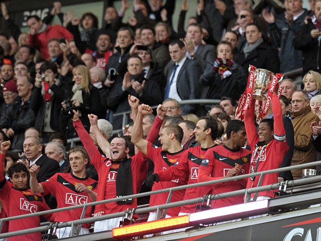 Manchester United celebrate with the trophy after beating Aston Villa 2-1 to win the 2010 Carling Cup Final at Wembley, in north London, on February 28, 2010