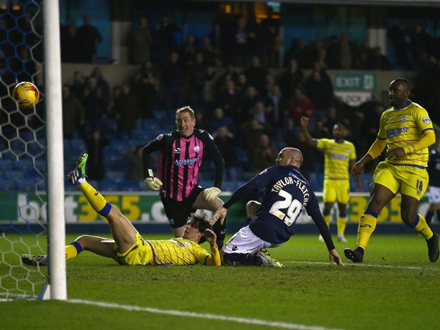 Gary Taylor-Fletcher of Millwall shoots at goal during the Sky Bet Championship match between Millwall and Sheffield Wednesday at The Den on February 24, 2015