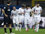 Fiorentina's Egyptian midfielder Mohamed Salah (2nR) celebrates with teammates after scoring during the Italian Serie A football match Inter Milan vs Firentina on March 1, 2015 