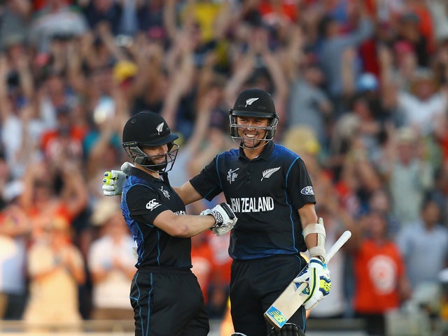 Kane Williamson and Trent Boult of New Zealand celebrate victory during the 2015 ICC Cricket World Cup match between Australia and New Zealand at Eden Park on February 28, 2015