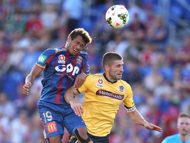Nick Montgomery of the Mariners contests the header against Mitch Cooper of the Jets during the round 19 A-League match between the Newcastle Jets and the Central Coast Mariners at Hunter Stadium on February 28, 2015