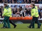 Massadio Haidara of Newcastle United is stretchered off injured during the Barclays Premier League match between Newcastle United and Aston Villa at St James' Park on February 28, 2015