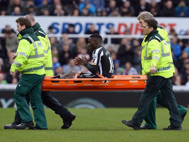 Massadio Haidara of Newcastle United is stretchered off injured during the Barclays Premier League match between Newcastle United and Aston Villa at St James' Park on February 28, 2015