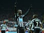 Papiss Demba Cisse of Newcastle United celebrates scoring the opening goal during the Barclays Premier League match between Newcastle United and Aston Villa at St James' Park on February 28, 2015