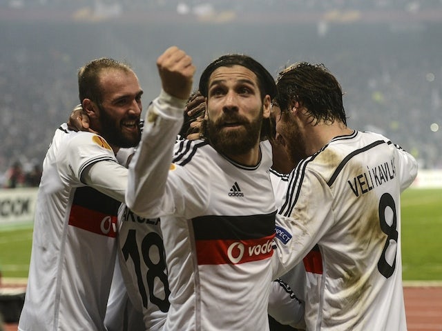 Besiktas' Olcay Sahan celebrates after his team scored during the UEFA Europa League round of 32 second-leg football match between Liverpool and Besiktas at Ataturk Olympic stadium on February 26, 2015