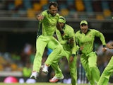Wahab Riaz of Pakistan celebrates with team mates after taking the wicket of Tewanda Mupariwa of Zimbabwe during the 2015 ICC Cricket World Cup match between Pakistan and Zimbabwe at The Gabba on March 1, 2015