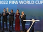 Qatar's Emir Sheikh Hamad bin Khalifa al-Thani (C) raises the World Cup trophy as he stands with FIFA president Sepp Blatter (R) after Qatar was chosen to host the 2022 World Cup at the FIFA headquarters in Zurich on December 2, 2010