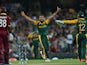 South Africa's spin bowler Imran Tahir celebrates his wicket of West Indies batsman Darren Sammy (L) during the 2015 Cricket World Cup Pool B match between South Africa and the West Indies at the Sydney Cricket Ground on February 27, 2015