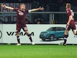 Torino's Polish defender Kamil Glik celebrates after scoring during the Italian Serie A football match Torino Vs Napoli on March 1, 2015