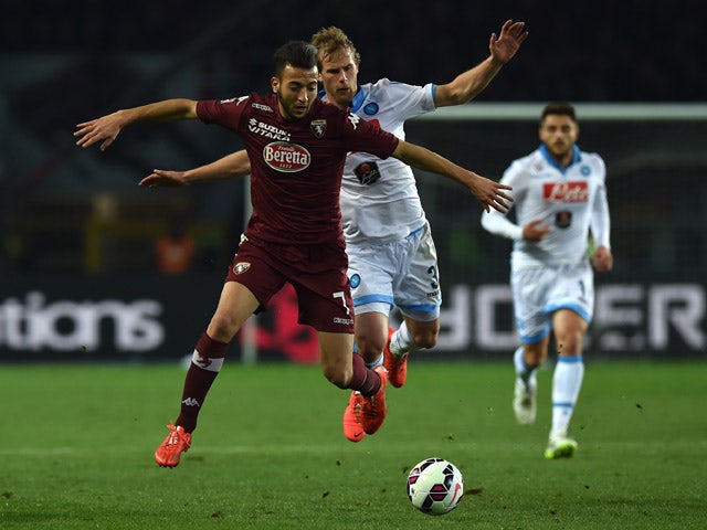 Omar El Kaddouri of Torino FC clashes with Ivan Strinic of SSC Napoli during the Serie A match between Torino FC and SSC Napoli at Stadio Olimpico di Torino on March 1, 2015