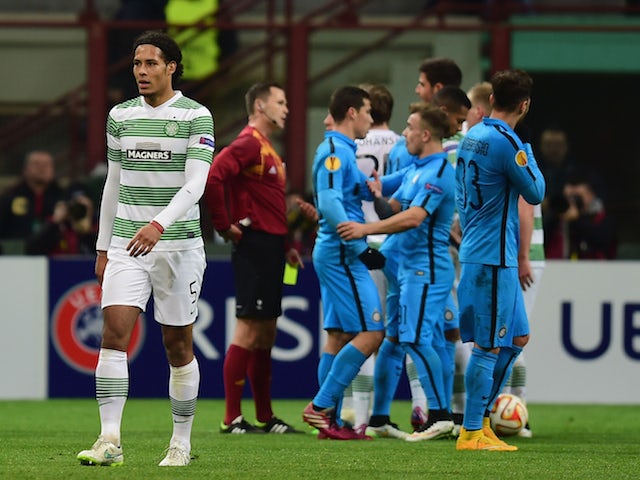 Virgil van Dijk of Celtic leaves the field after being dismissed with a second yellow card during the UEFA Europa League Round of 32 match against Inter Milan on February 26, 2015