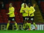 Odion Ighalo of Watford (24) celebrates with Troy Deeney (9) and Almen Abdi (22) as he scores their first goal during the Sky Bet Championship match between Watford and Rotherham United at Vicarage Road on February 24, 2015