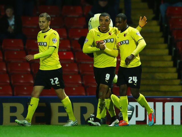 Odion Ighalo of Watford (24) celebrates with Troy Deeney (9) and Almen Abdi (22) as he scores their first goal during the Sky Bet Championship match between Watford and Rotherham United at Vicarage Road on February 24, 2015