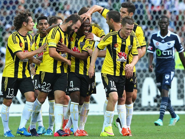 Rolieny Bonevacia of the Phoenix is congratulated by team mates after scoring a goal during the round 19 A-League match between the Melbourne Victory and the Wellington Phoenix at AAMI Park on March 1, 2015