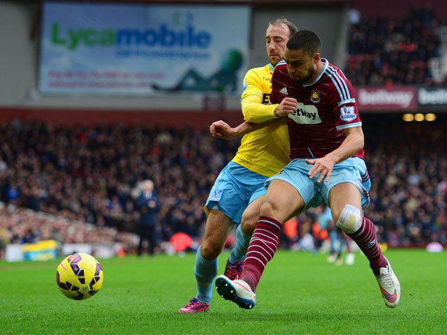 Winston Reid of West Ham United battles with Glenn Murray of Crystal Palace during the Barclays Premier League match between West Ham United and Crystal Palace at Boleyn Ground on February 28, 2015