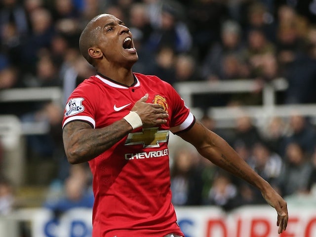 Manchester United's English midfielder Ashley Young celebrates scoring the opening goal of the English Premier League football match against Newcsastle on March 4, 2015