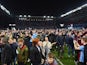 Aston Villa fans celebrate victory on the pitch after the FA Cup Quarter Final match between Aston Villa and West Bromwich Albion at Villa Park on March 7, 2015