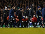 Bafetibis Gomis of Swansea City is stretchered off during the Barclays Premier League match between Tottenham Hotspur and Swansea City at White Hart Lane on March 4, 2015