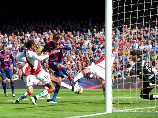 Gerard Pique of FC Barcelona scores his team's second goal during the La Liga match between FC Barcelona and Rayo Vallecano de Madrid at Camp Nou on March 8, 2015