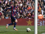 Barcelona's Argentinian forward Lionel Messi scores a goal during the Spanish league football match FC Barcelona vs Rayo Vallecano de Madrid at the Camp Nou stadium in Barcelona on March 8, 2015