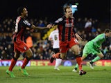 Brett Pitman of Bournemouth celebrates with Callum Wilson as he scores their third goal during the Sky Bet Championship match between Fulham and AFC Bournemouth at Craven Cottage on March 6, 2015
