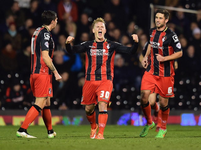 Matt Ritchie of Bournemouth (30) celebrates with team mates as he scores their second goal during the Sky Bet Championship match between Fulham and AFC Bournemouth at Craven Cottage on March 6, 2015