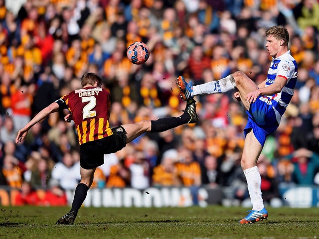Stephen Darby of Bradford City and Pavel Pogrebnyak of Reading compete for the ball during the FA Cup Quarter Final match between Bradford City and Reading at the Coral Windows Stadium, Valley Parade on March 7, 2015