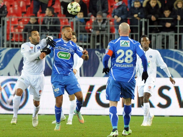 Brest's forward Youssef Adnane vies with Auxerre's midfielder Remi Mulumba (2-L) during the French Cup football match between Brest and Auxerre on March 5, 2015