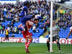 Cardiff City player Kenwyne Jones beats Morgan Fox of Charlton to the ball to set up the first goal during the Sky Bet Championship match between Cardiff City and Charlton Athletic at Cardiff City Stadium on March 7, 2015