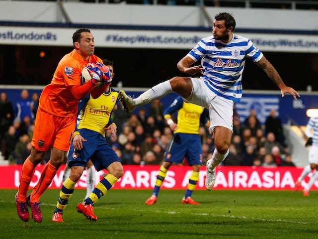 Charlie Austin of QPR challenges goalkeeper David Ospina of Arsenal during the Barclays Premier League match on March 4, 2015