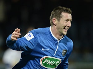 Concarneau's midfielder Christophe Gourmelon celebrates after scoring a goal during the French Cup football match between Concarneau and Guingamp at the Moustoir stadium in Lorient, western France, on March 5, 2015