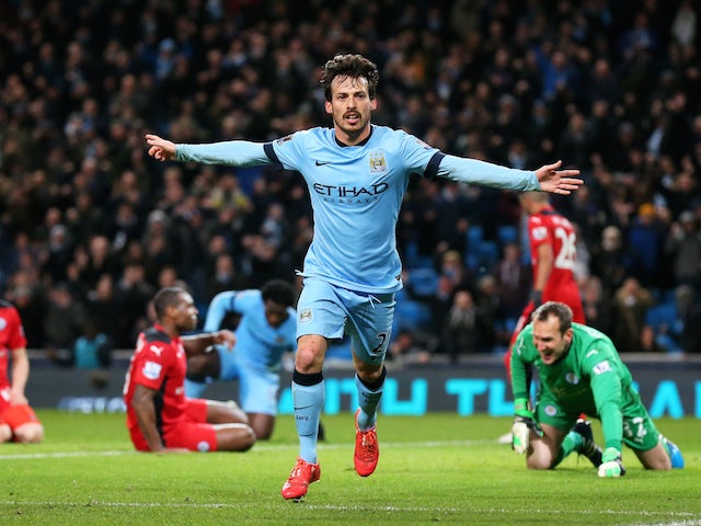David Silva of Manchester City celebrates after scoring the opening goal during the Barclays Premier League match against Leicester City on  March 4, 2015