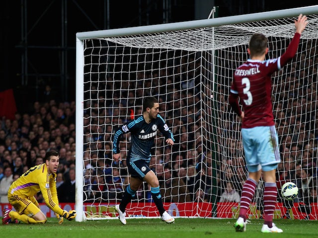 Eden Hazard of Chelsea turns away to celebrate after scoring the opening goal during the Barclays Premier League match against West Ham on March 4, 2015