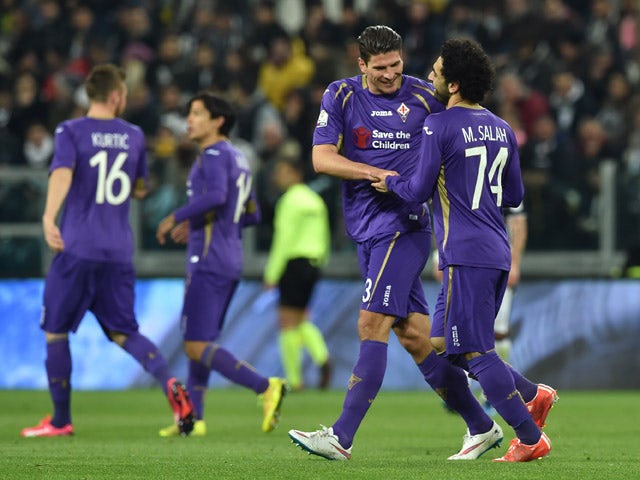 Mohamed Salah (R) of ACF Fiorentina celebrates the opening goal with team mate Mario Gomez during the TIM Cup match between Juventus FC and ACF Fiorentina at Juventus Arena on March 5, 2015