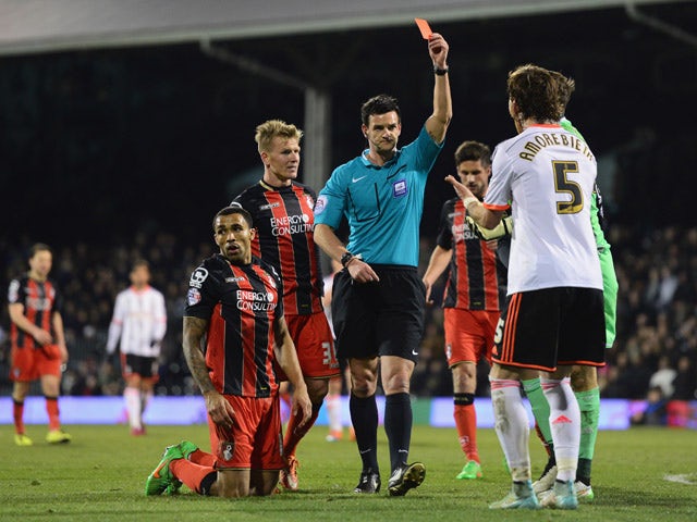 Brett Pitman of Bournemouth celebrates with Callum Wilson as he scores their third goal during the Sky Bet Championship match between Fulham and AFC Bournemouth at Craven Cottage on March 6, 2015