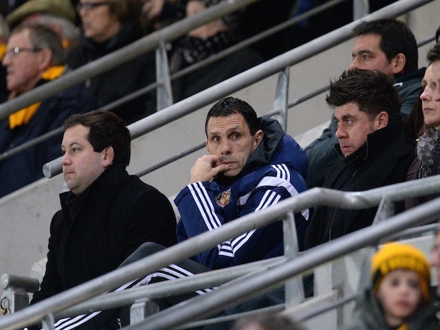 Sunderland's Uruguayan manager Gus Poyet (C) watches from the stands during the English Premier League football match against Hull City on March 3, 2015