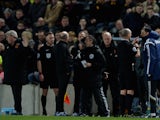  Referee Mike Dean sends Gustavo Poyet the manager of Sunderland to the stands after clashing with Steve Bruce the manager of Hull City during the Barclays Premier League match on March 3, 2015
