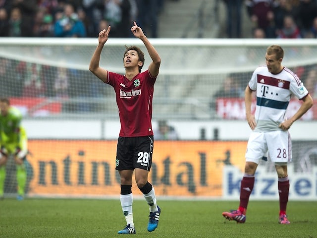 Hannover's Japanese midfielder Hiroshi Kiyotake celebrates scoring the opening goal during the German first division Bundesliga football match against Bayern Munich on March 7, 2015