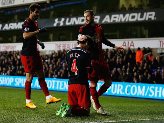 Ki Sung-Yueng of Swansea City (4) celebrates with team mates as he scores their first and equalising goal during the Barclays Premier League match against Tottenham Hotspur on March 4, 2015