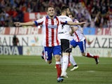 Atletico Madrid's midfielder Koke celebrates after scoring during the Spanish league football match Atletico Madrid vs Valencia CF at the Vicente Calderon stadium in Madrid, on March 8, 2015