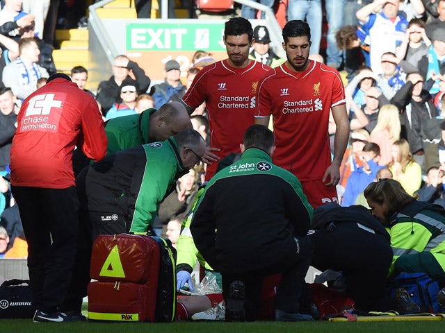 Liverpool's Slovakian defender Martin Skrtel is treated after a challenge with Blackburn's French-born Beninese striker Rudy Gestede during FA Cup quarter-final match between Liverpool and Blackburn Rovers at Anfield in Liverpool, north west England on Ma