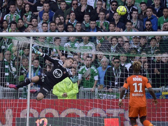 Lorient's French goalkeeper Benjamin Lecomte jumps to punch the ball back during the French L1 football match between Saint-Etienne (ASSE) and Lorient (FCL) on March 8, 2015