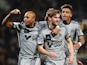 Marseille's French defender Baptiste Aloe celebrates with teammates after scoring a goal during the French L1 football match between Toulouse and Marseille in Toulouse, southwestern France, on March 6, 2015