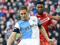 Blackburn's English defender Matthew Kilgallon (L) clears the ball during FA Cup quarter-final match between Liverpool and Blackburn Rovers at Anfield in Liverpool, north west England on March 8, 2015