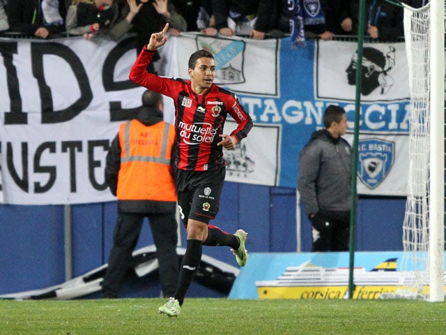 Nice's Brazilian midfielder Carlos De Olivera Alves celebrates after scoring a goal during a French L1 football match Bastia (SCB) against Nice (OGCN) at the Armand Cesari stadium in Bastia on March 7, 2015